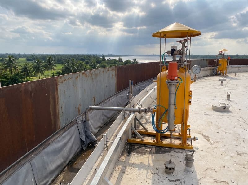 Rim seal fire protection units around the floating roof of a storage tank at a riverside refinery