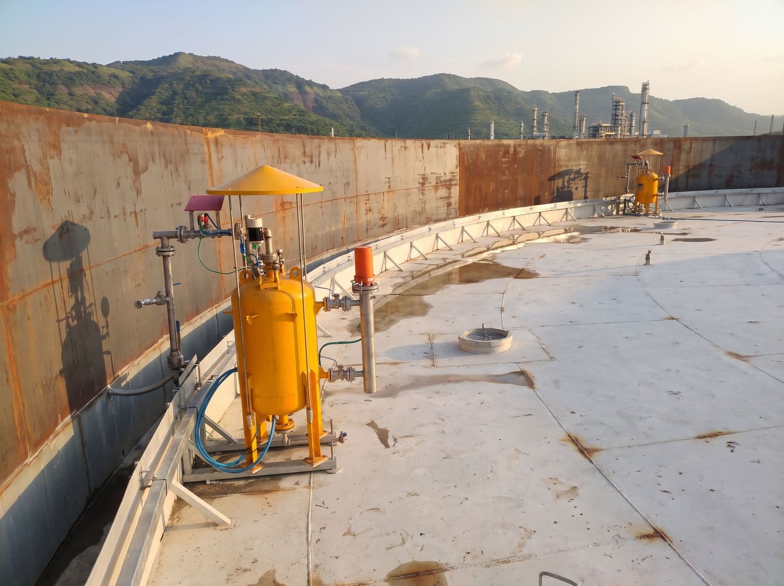 Rim seal fire protection units around the floating roof of a storage tank at a petrochemical complex