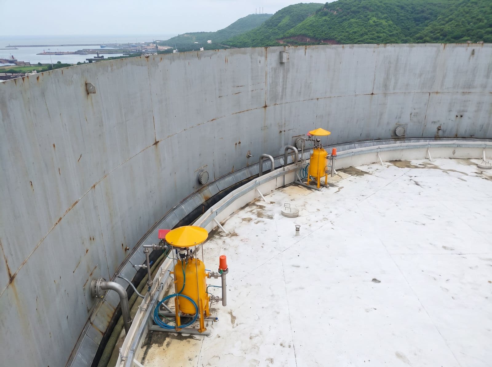 Rim seal fire protection units around the floating roof of a storage tank at a coastal refinery