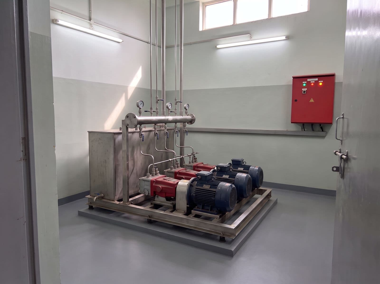 High-pressure water mist pump unit with stainless steel manifold in a pump room
