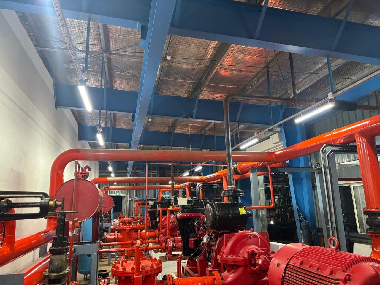 Fire pumps and header piping inside the pump house