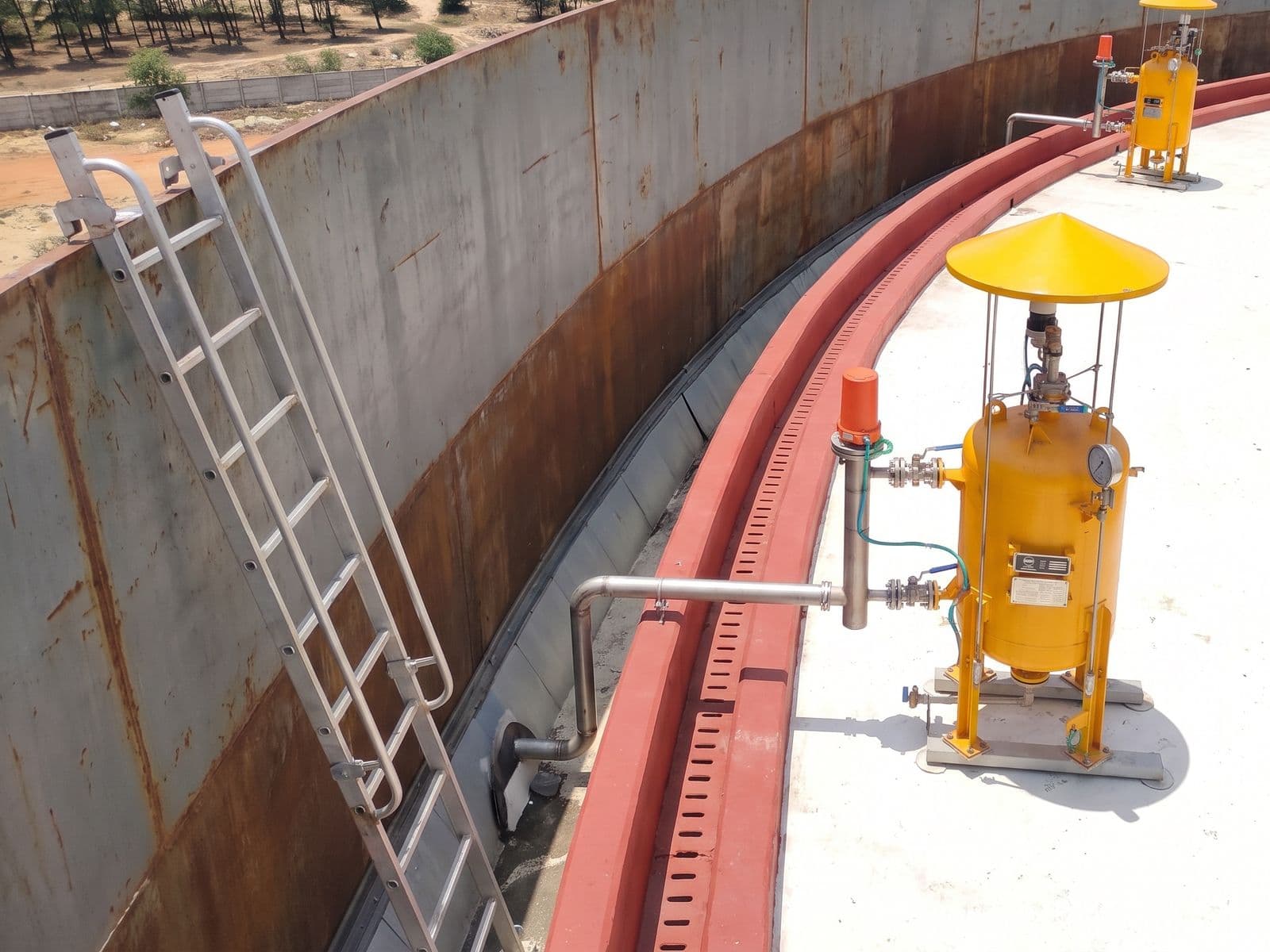 Rim seal fire protection units around the floating roof of a storage tank at a coastal terminal